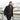 Man wearing a dark navy shearling-collar Bedford cord jacket with button front.
