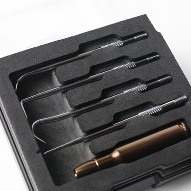 Foam tray with five metal picks and a brass-colored pin tool, in a black case