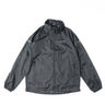 Packable rain jacket in dark black, full-zip front with stand collar and hood.