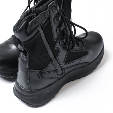 8-inch tactical boot close-up of side and ankle area with laces, strap, and textured panel.