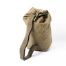 Beige canvas duffel bag with top clasp and adjustable shoulder strap