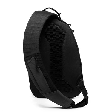 Dark grey sling backpack with mesh back panel and side straps