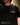 Black T-shirt with colorful graphic logo on left chest, crew neck