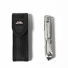 Silver multitool clipped in black nylon sheath