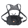 Small tactical chest pack, black fabric, front flap and MOLLE webbing