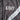 Dark grey army jacket detail with ARMY lettering and white chevron trim