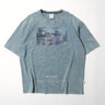 Light blue graphic crewneck T-shirt with rectangular blue print and "NAVAL FLEET" text