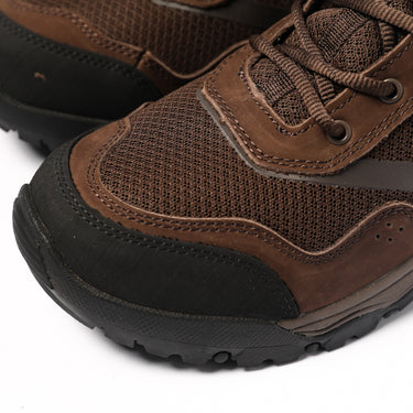 Brown lace-up boots with mesh panels, stitched overlays, and cushioned tread sole