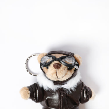 Plush teddy key ring face with pilot goggles and brown leather jacket