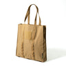 Canvas tote bag in khaki with tan webbing handles and front patch pocket