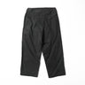 Black vintage US field pants side view with cargo pockets and buttoned cuffs
