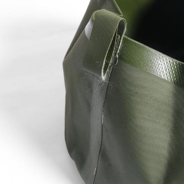 Olive drab washbowl rim with webbing carry loop, collapsible plastic basin