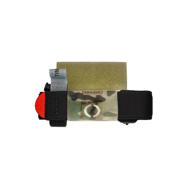Agilite tourniquet holder pouch, olive green with black straps and securing loop