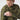 Camouflage field shirt with textured shoulder patch and zippered sleeve pocket