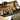 Utility platform case with tan interior, open storage compartments, and rifle accessories