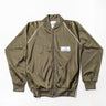 Olive drab zip-up track jacket with stand collar, stripe piping, and chest patch