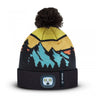 Knit beanie cap with pom-pom, yellow and blue mountain pattern, black cuff with LED badge