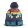 Multicolor deer knit beanie with striped pattern, bold cuff text, and navy pom-pom