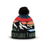 Multicolor mountain knit beanie with black pom-pom and Explore Now lettering