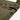 Close-up of front flap edge with sleeve-style strap and multicam woodland pattern