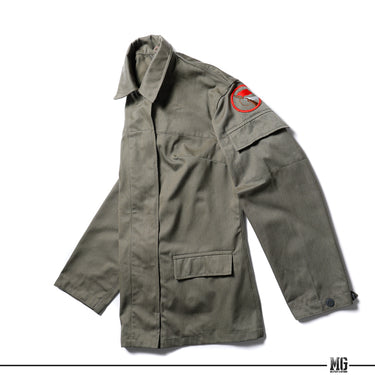 Olive drab summer field jacket, angled side view, button placket, chest pocket and sleeve pocket