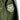 Olive drab jacket sleeve detail with large white shield patch and metal snap
