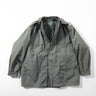 Grey military-style coat with hood, full zipper, flap pockets and button details
