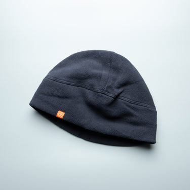 Midnight blue fleece watch cap with folded cuff and small logo patch