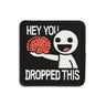 Embroidered meme patch with figure, 'HEY YOU' and 'DROPPED THIS' text