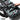 Rifle bag in Miami tiger stripe camo with webbing straps, buckles, and padded handles