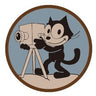 Round fabric patch with Felix the Cat character on a film camera tripod
