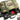 Camouflage mini hauler with green webbing and open top, showing red interior pouch