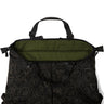 Black patterned tote bag with olive interior panel and zip-top opening