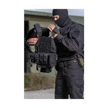 Black tactical armor vest worn with adjustable straps and front plate pocket