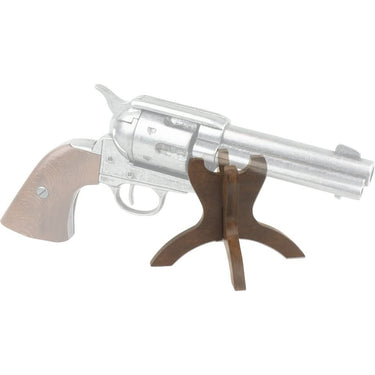 Denix wood stand holding a toy revolver, dark wooden tri-foot support base.