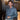 Blue chambray work shirt with button front and chest pockets, long sleeves.