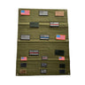 Olive green patch panel with scattered flag patches and metal grommets at corners