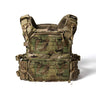Multicam-pattern plate carrier vest with padded shoulder straps and front storage panels.
