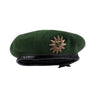 Green police beret with crest insignia badge and black band
