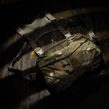 Camouflage chest pack with shoulder harness straps and front panel pocket
