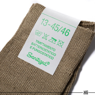 Khaki wool crew sock heel and toe close-up with care label