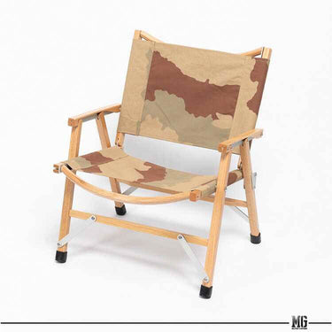 Foldable wooden camping chair with desert camo fabric seat, back panel, and arm rests