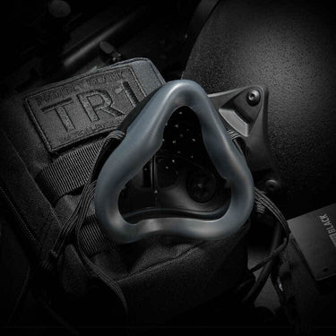 Tactical respirator mask with perforated face and black headband frame