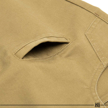 Men's hero shorts fabric panel with stitched curved pocket opening in tan.