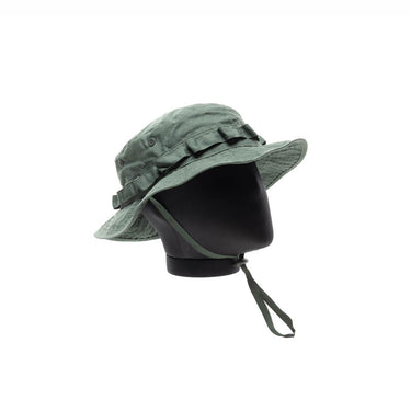 Olive jungle hat with wide brim, chin cord, side button tabs.