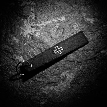 Sturm EK embroidered key ring, black strap with white cross emblem and attached key loop