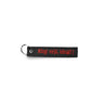 Black embroidered key ring with red text patch and metal ring