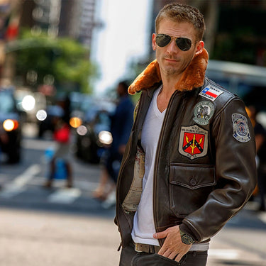 Men's dark leather flight jacket with brown shearling collar and embroidered sleeve patch